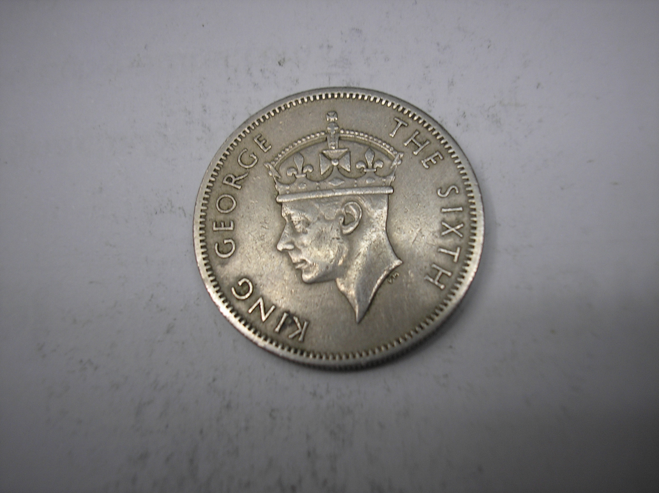 RODESIA. ONE SHILLINGS DE METAL DE 1952